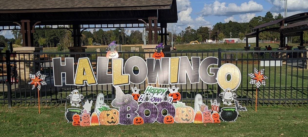 HalloWINGO sign surrounded by Halloween decorations