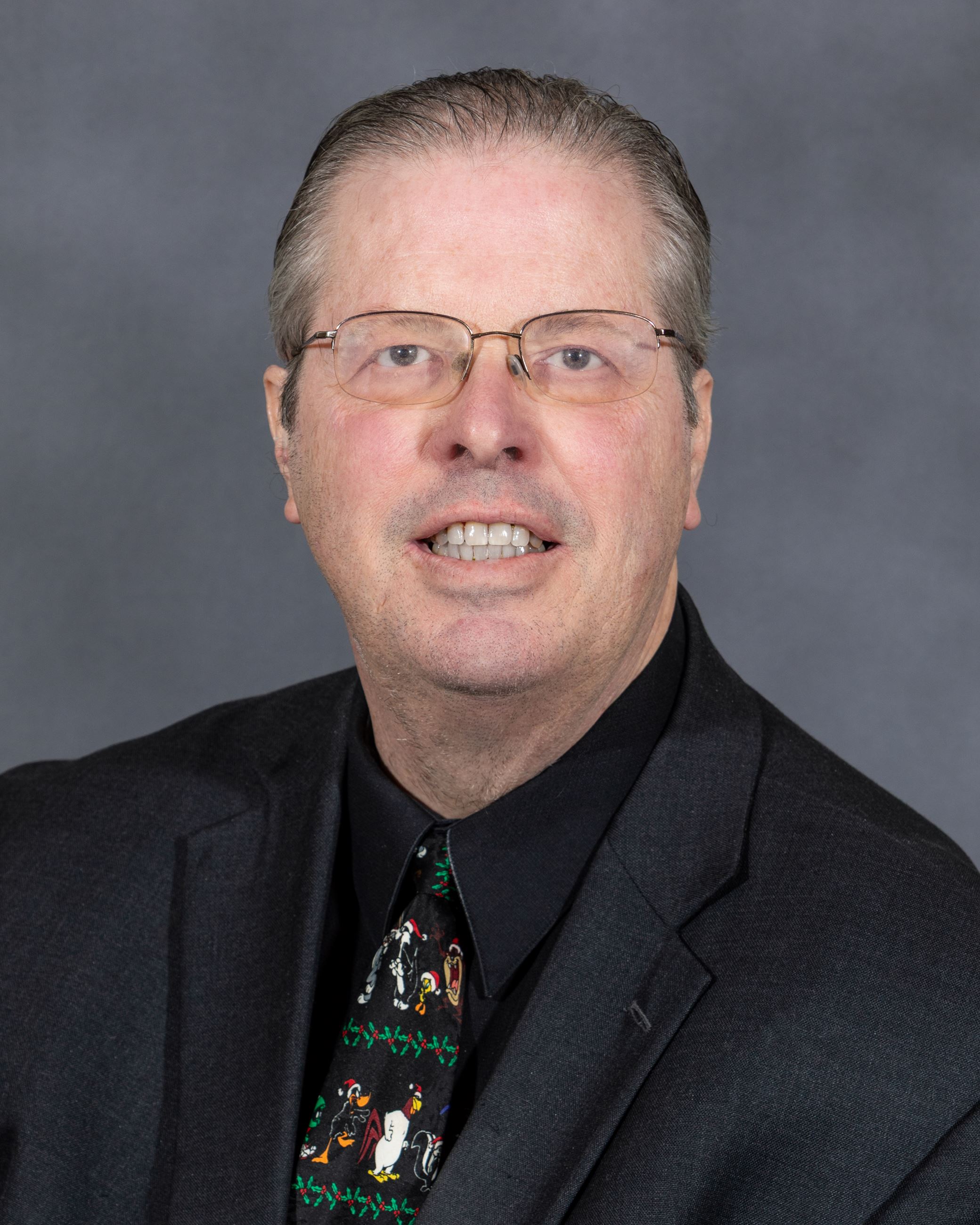 Professional headshot of Council Member Todd Barber