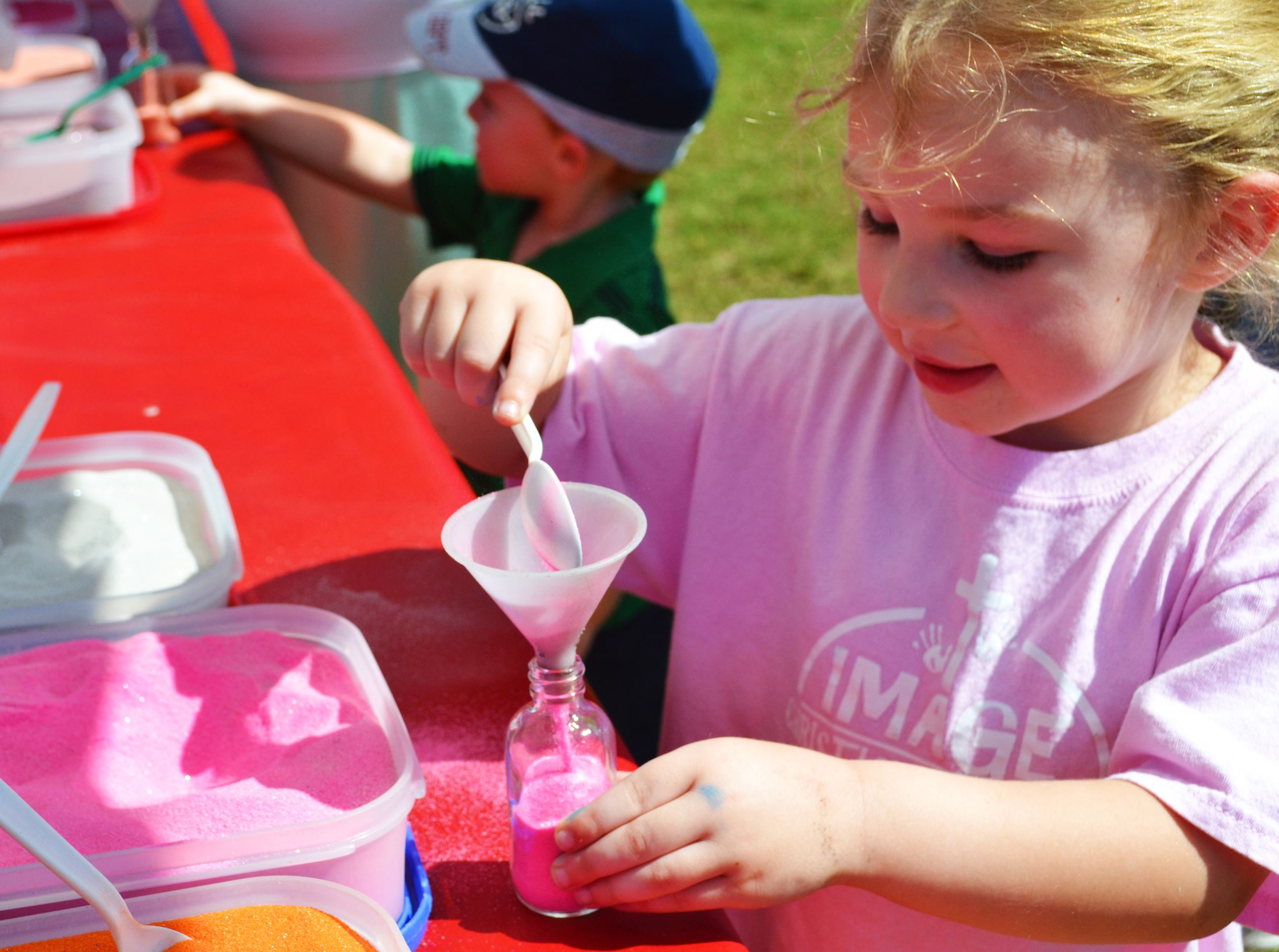 A child creates a craft.