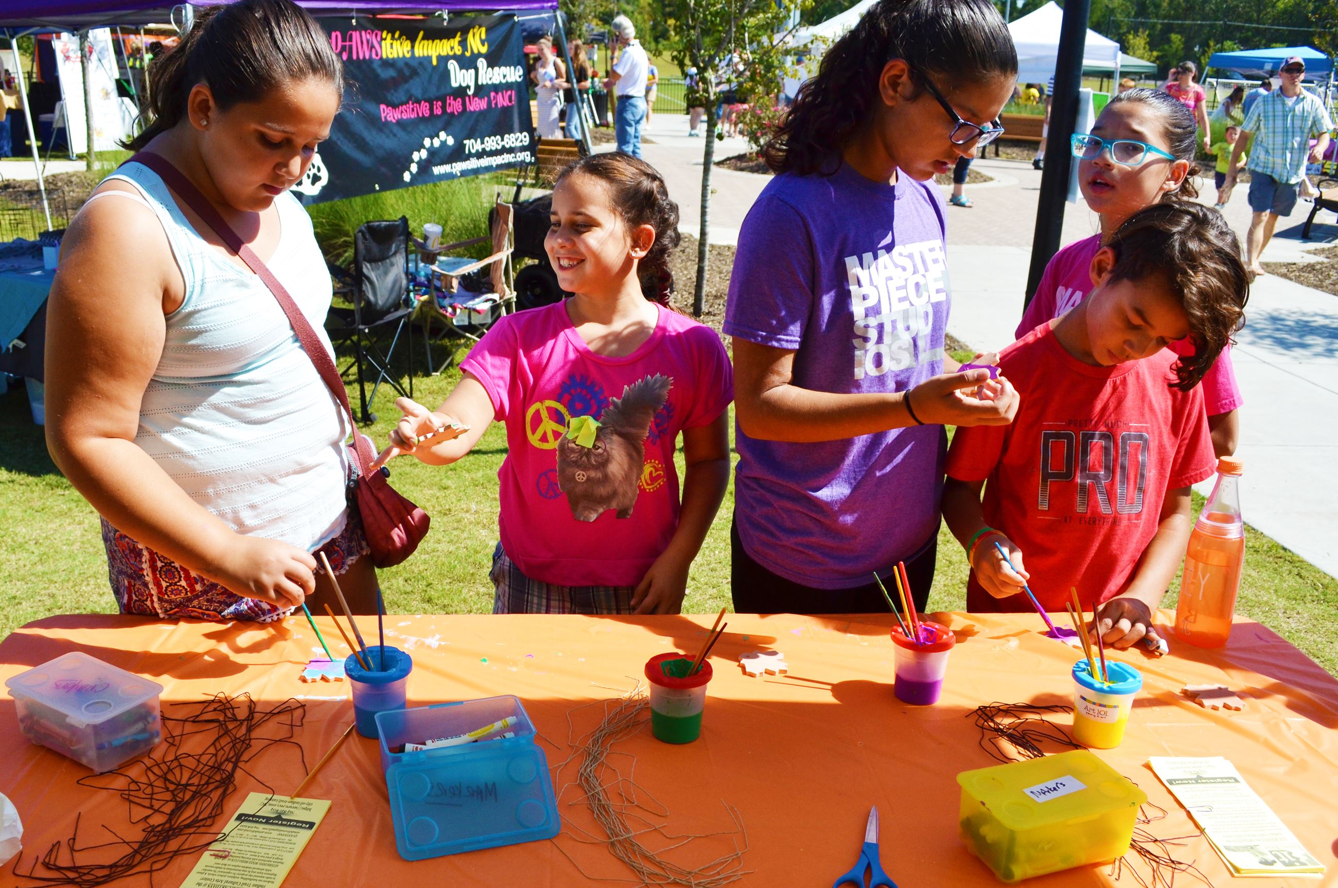 Children check out a craft station.