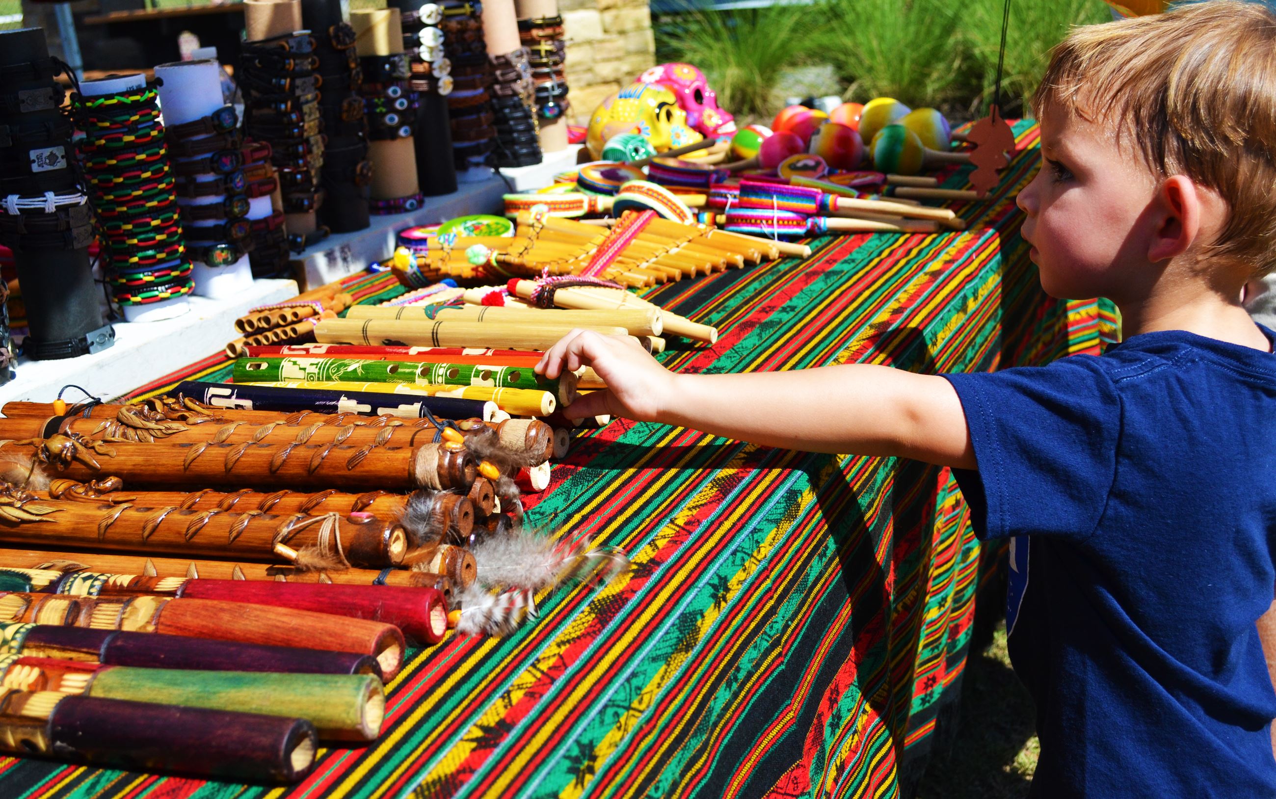 A child checks out a vendor's display.