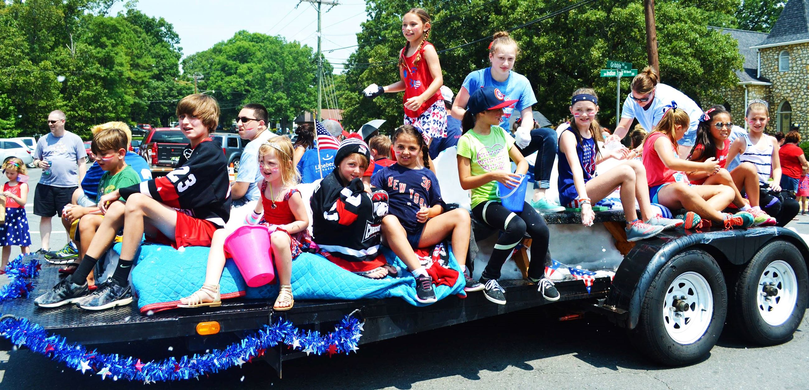 A parade float drives by